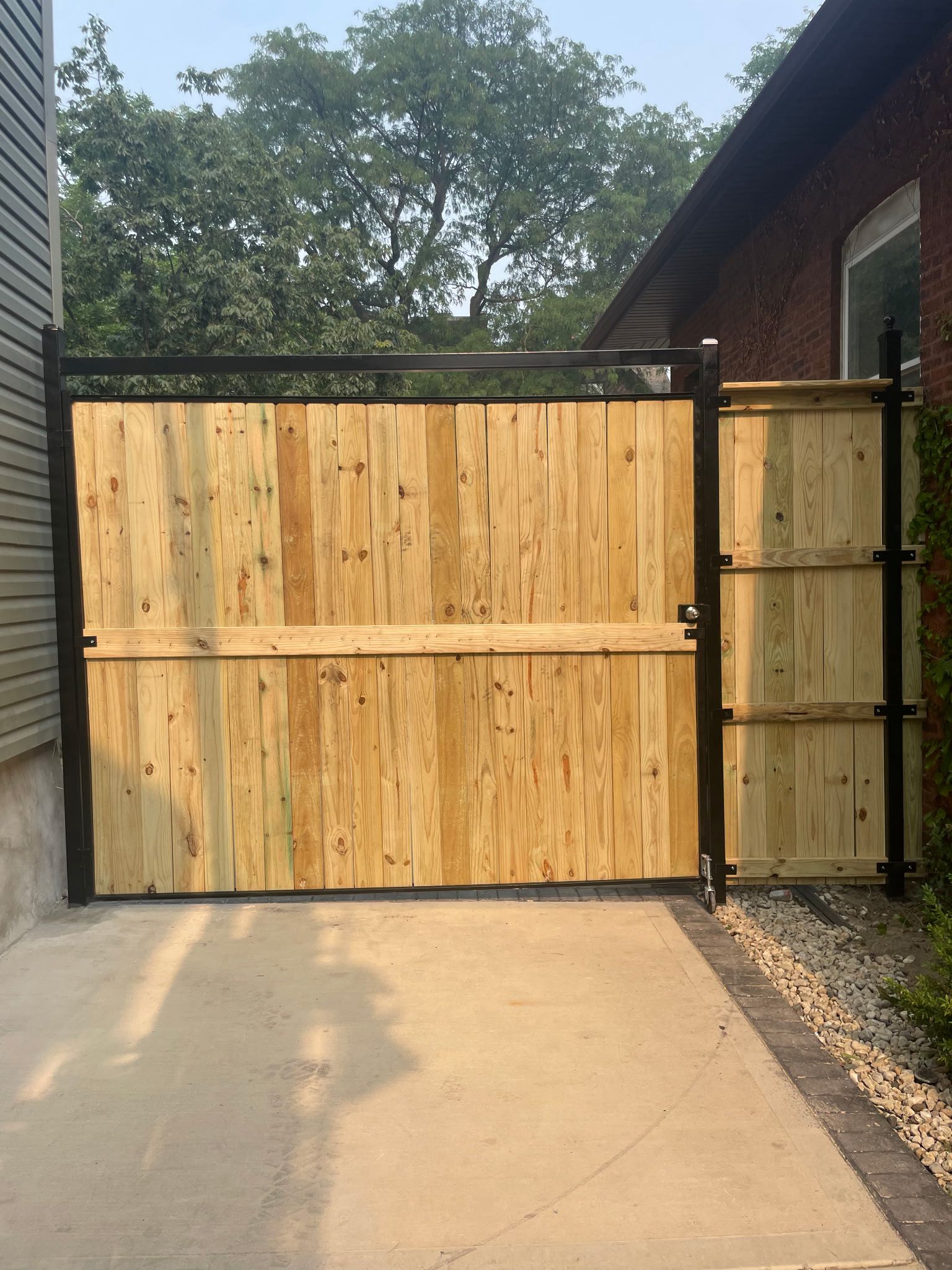 Custom wood and metal driveway gate