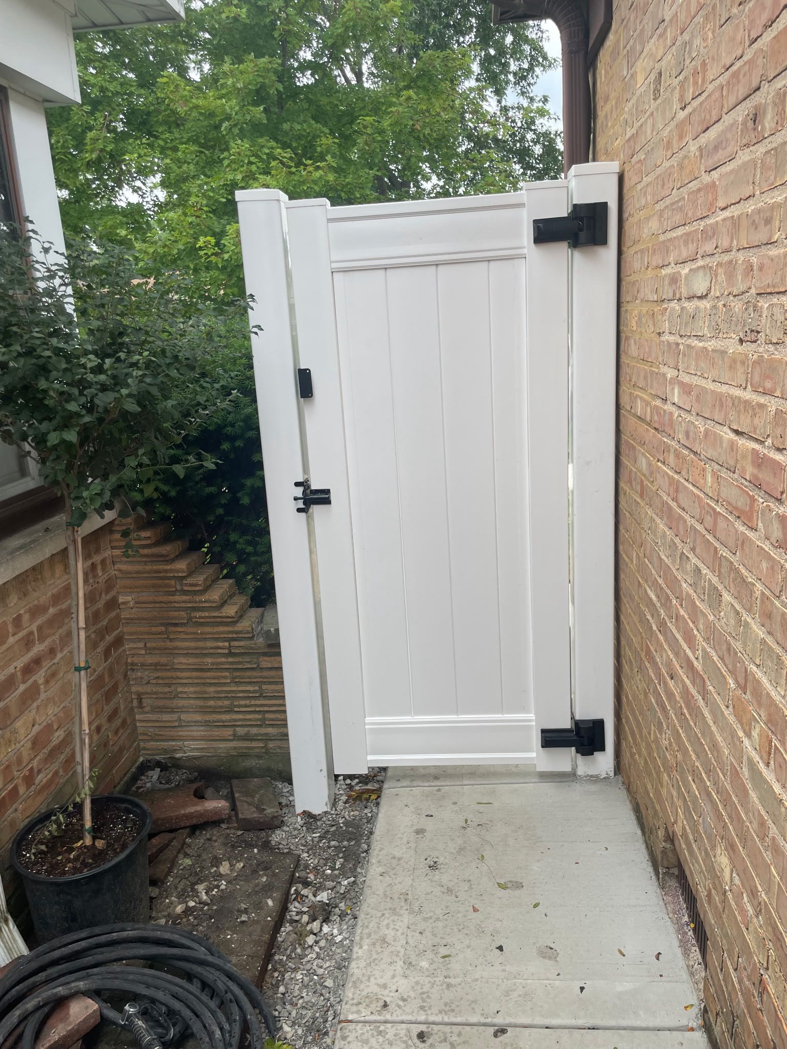 White vinyl gate installation